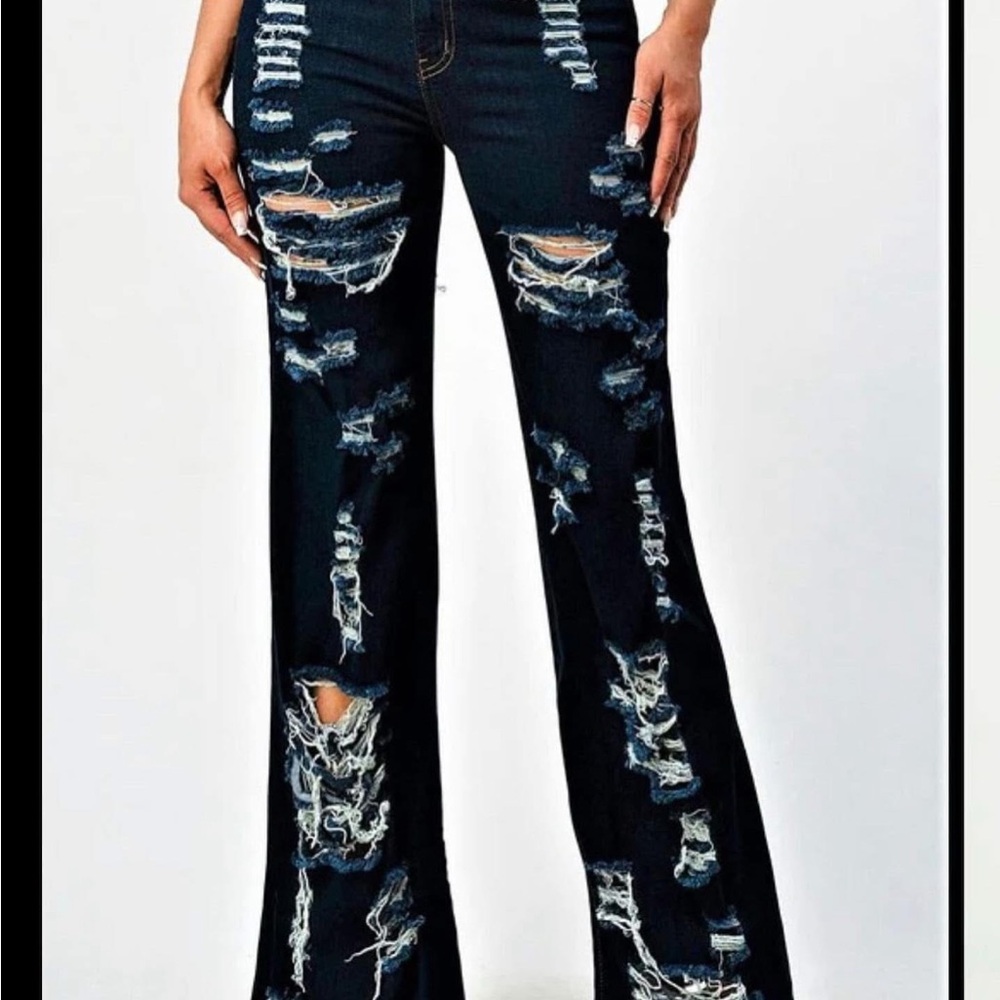 Distressed Dark Blue Flare Jeans. I have a few sizes. From sz 1-7